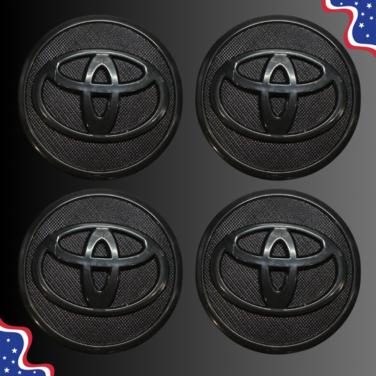 Set of four 57 mm Toyota-compatible black wheel center caps, front view